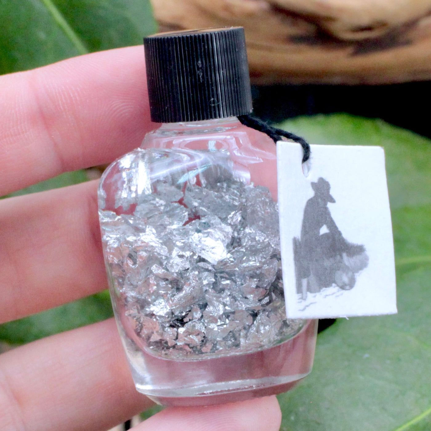 Silver Flakes in Bottle