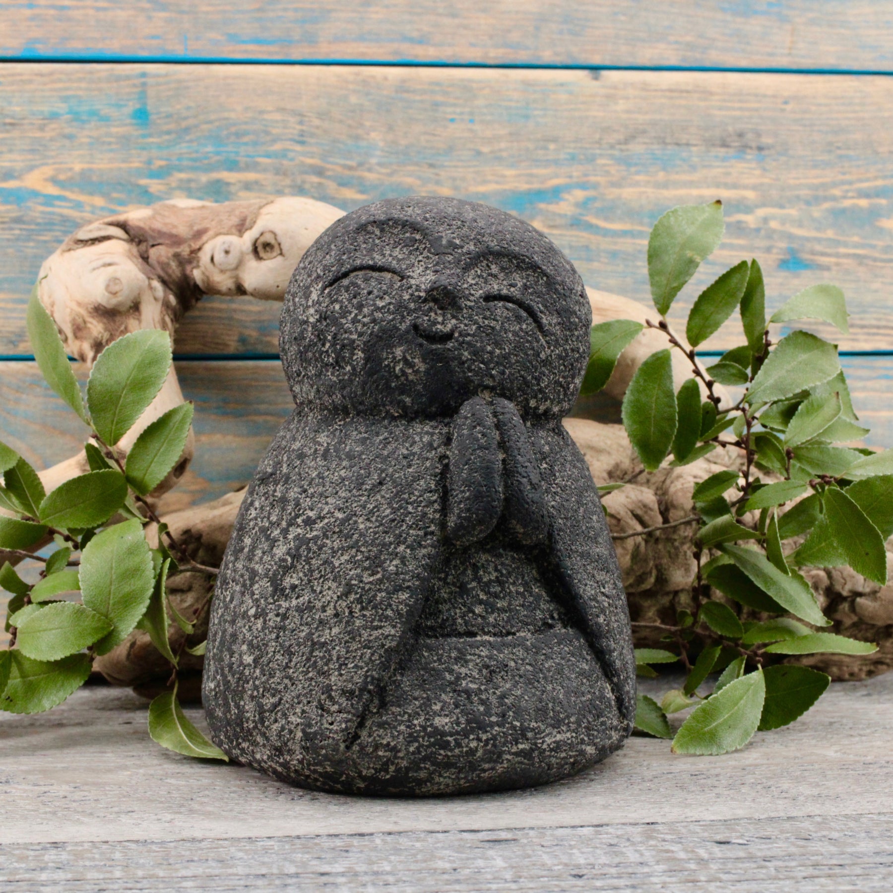 photo of a smiling Buddha statue